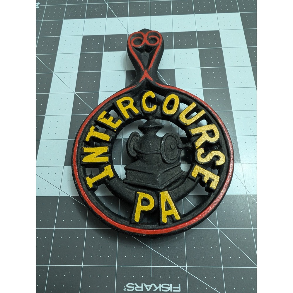 Intercourse PA cast‎ iron footed trivet spoon rest red & yellow painting grain